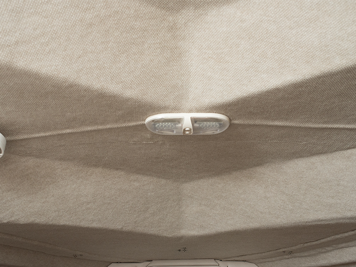 Carpet-style headliner installed in a powerboat cabin